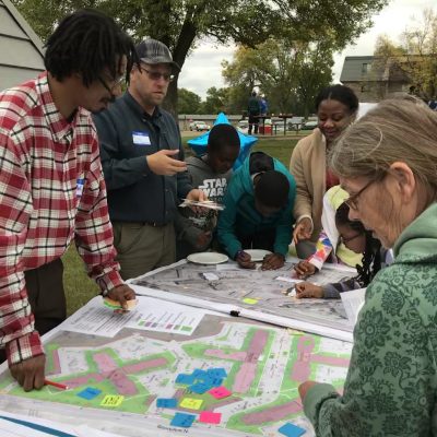 People looking at a design for a new landscape