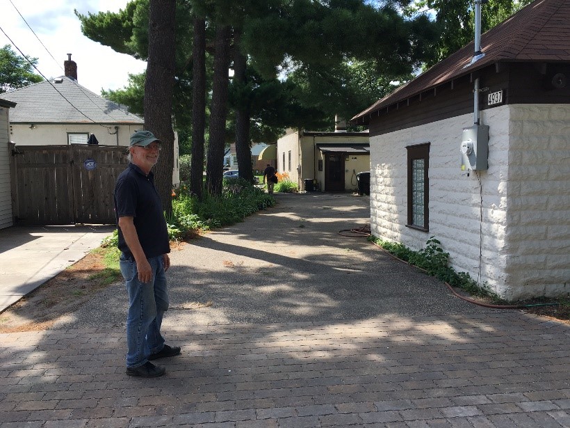 Business owner Keith Nybakke says “before Blooming Alleys, 100% of my runoff was leaving my property. Now, nearly 100% is captured by my permeable pavement and raingardens.”