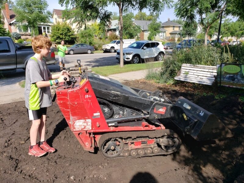buy operating landscaping machinery in dirt yard