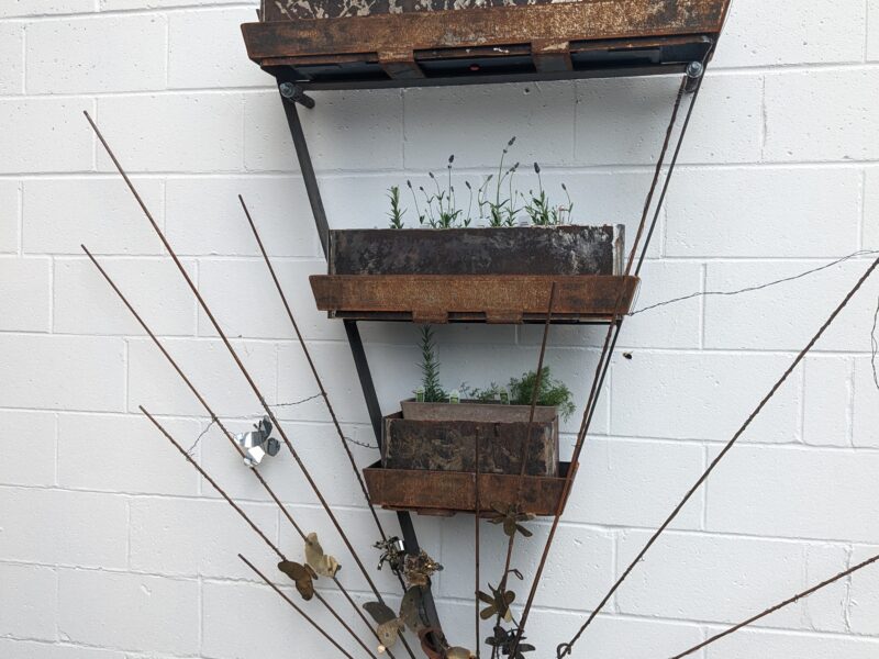 sculptural wall planter with new plants