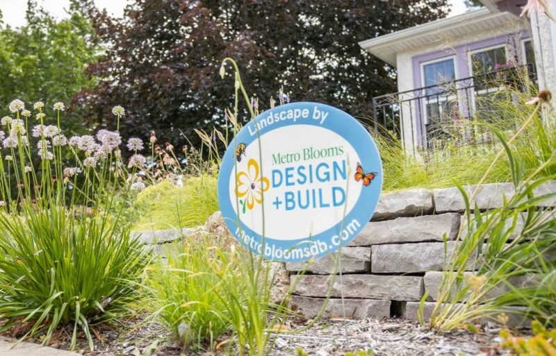 Design and Build sign in a yard