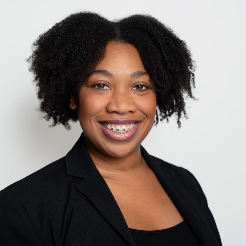 Head and shoulders photo of woman in suit