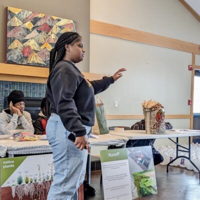 Laila Bacon sharing information on native plants and runff