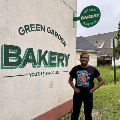 Jaden Scott in front of Green Garden Bakery with hands in pockets